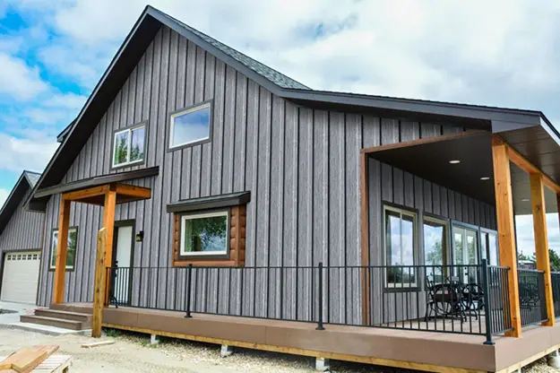 Modern home with dark metal board-and-batten siding