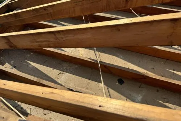 Exposed roof decking and rafters during a roof repair